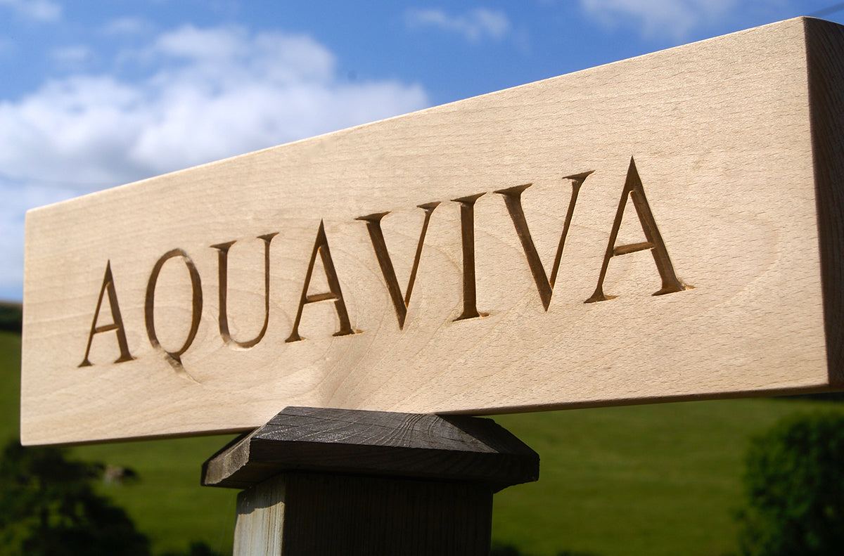 Carved House Sign
