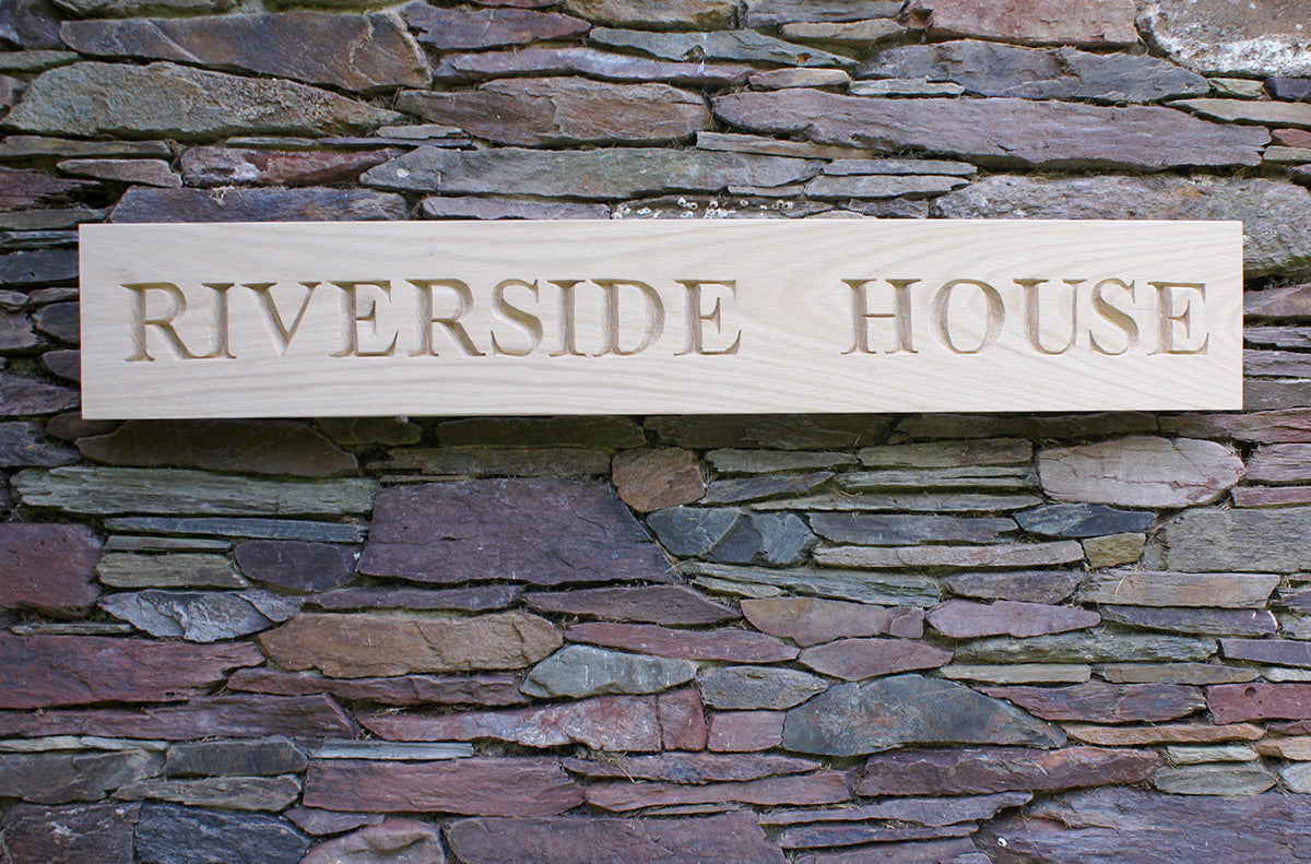 Carved House Sign